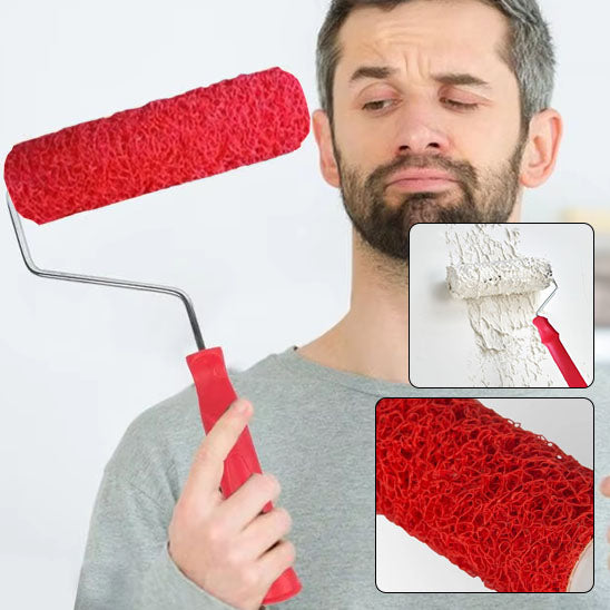homme barbu tient et regarde rouleau peinture rouge avec poignée rouge
