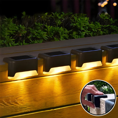 lampe solaire extérieur illumine bordure de jardin