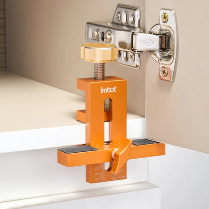 Gabarit de perçage orange supportant portière meuble blanc fixation charnière droite