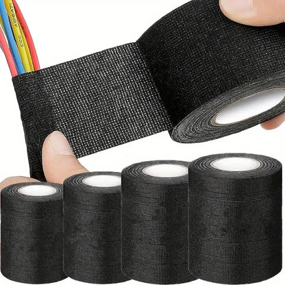 main enroule rouleau Ruban adhesif noir , faisseau fils electriques multicolors , rouleaux ruban adhesifs noirs
