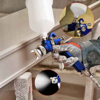 main tenant pistolet peinture bleu avec buse