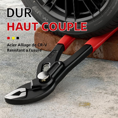 Pince multiprise poignee rouge entre  roue voiturer et brique rouge , métal, outil robuste ,usages variés en bricolage et plomberie