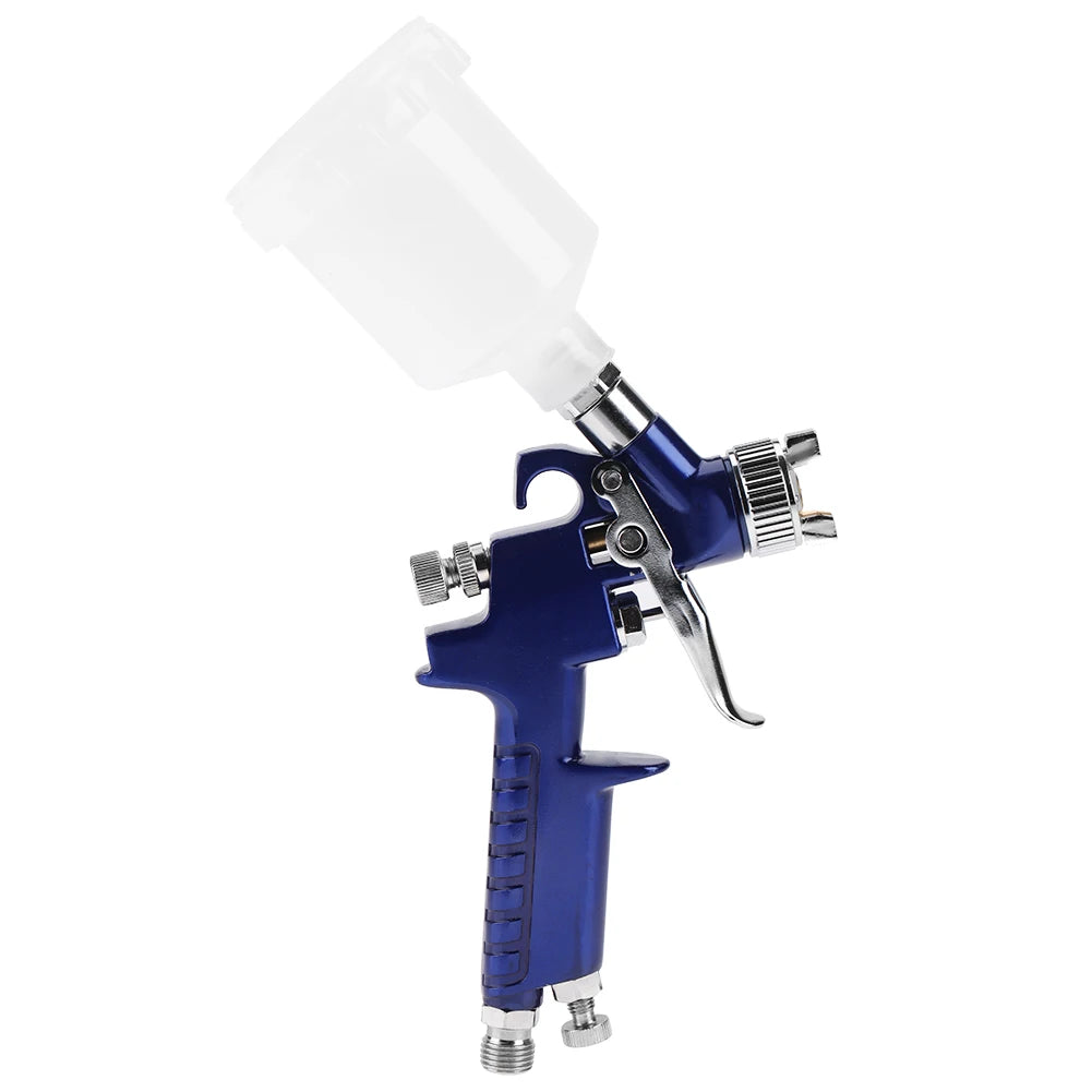 pistolet peinture bleu avec réservoir blanc et buse