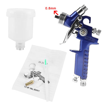 Pistolet peinture avec réservoir blanc pulvérise peinture bleue