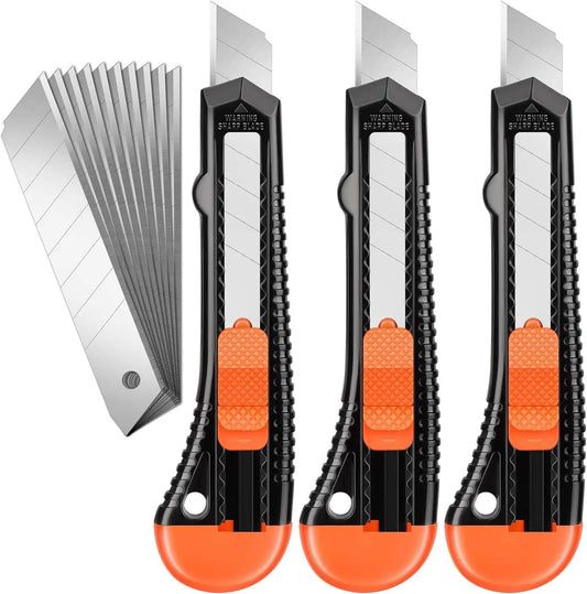 Trois cutter orange et des lames